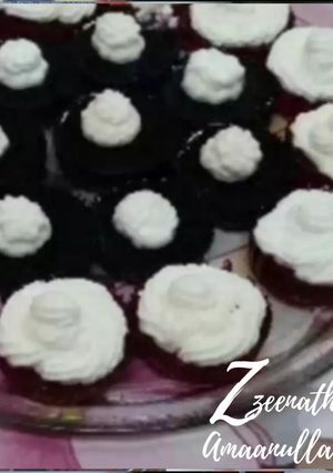 A picture of Jello Cupcakes with Whipped Cream.