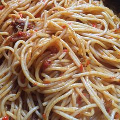 A picture of Stir-fry jollof spaghetti.