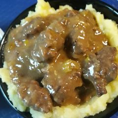 A picture of Golden Mashed Potatoes and Beef Square Gravy.