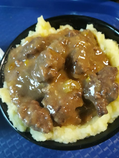 A picture of Golden Mashed Potatoes and Beef Square Gravy.