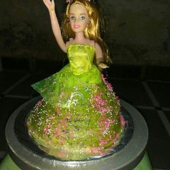 A picture of Wheat Flour 3 layered Barbie Doll Beetroot Cake.