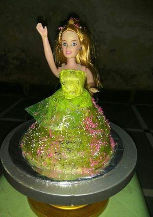 A picture of Wheat Flour 3 layered Barbie Doll Beetroot Cake.