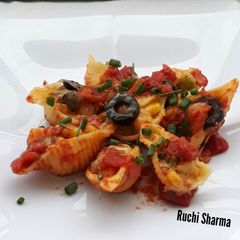 Cheese and vegetable stuffed shell pasta A picture of Cheese and vegetable stuffed shell pasta.