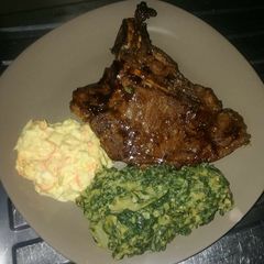 A picture of Grilled Beef steak, Creamed Spinach with coselaw.