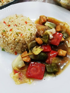 A picture of Stir fry chicken with Egg fried rice 🍚.