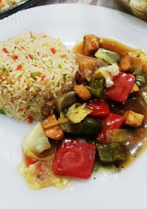 A picture of Stir fry chicken with Egg fried rice 🍚.