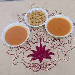 A picture of Rooted Warmth Carrot–Ginger Soup (with Protein Chhole Crunch).
