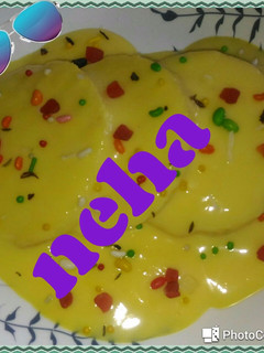 A picture of Bread rasmalai in custard.
