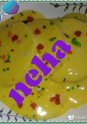 A picture of Bread rasmalai in custard.