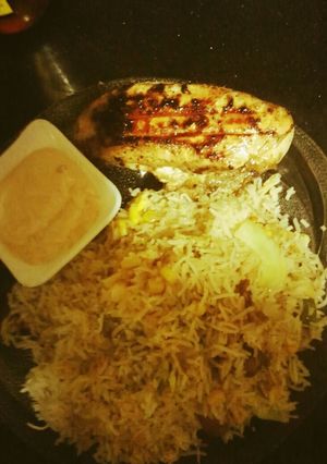 A picture of Peri peri chicken with rice.