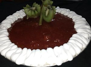 Una foto de Cheesecake New York con compota de fresas