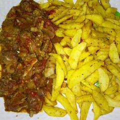 A picture of Fried potatoes with sauce.