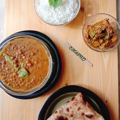 A picture of Masoor Dal with roti & chawal.