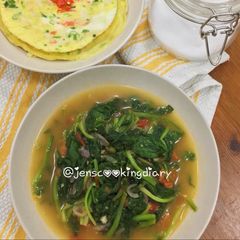 A picture of Stir Fry Spinach with Tomato.