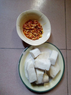 A picture of Egg sauce and yam.