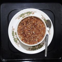 A picture of NOLEN GURER CHENA PORA (baked nolen gur cottage cheese).