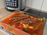 Une photo de couscous poulet merguez