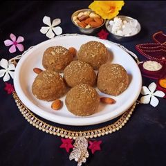 A picture of Churma ladoo with jaggery (traditional Gujrati sweet).