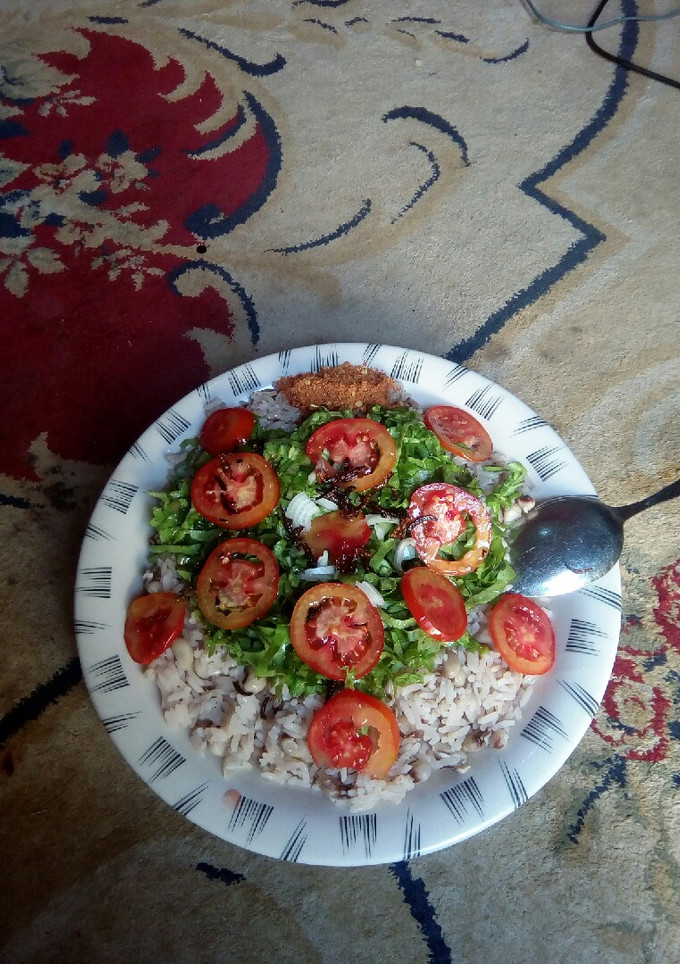 A picture of Local rice nd beans with lattice.