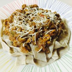 A picture of Eggplant Caponata on Eggless Basil Pappardelle.