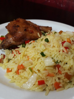 A picture of Fried rice with chicken.