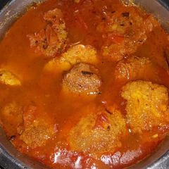 A picture of Fish egg fritters curry.