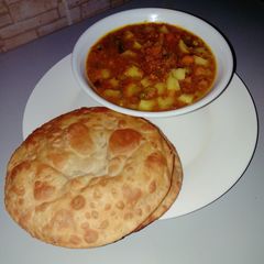 A picture of Puri with potato dutch soup.
