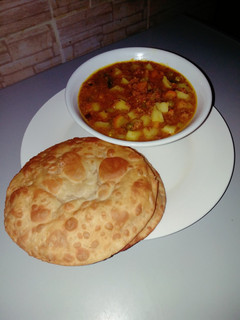 A picture of Puri with potato dutch soup.