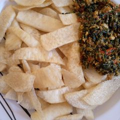 A picture of Fried yam with veg source.