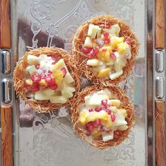 A picture of Delightful dessert-Fruit custard basket.