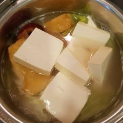 A picture of Tofu, beanpuff and cabbage soup.