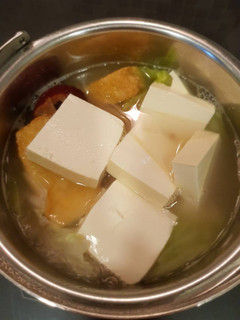 A picture of Tofu, beanpuff and cabbage soup.