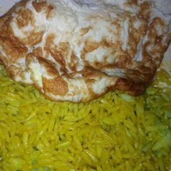 A picture of Rice with fried egg.