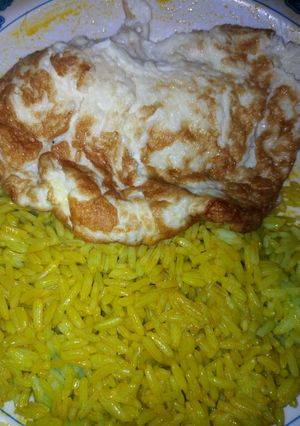 A picture of Rice with fried egg.