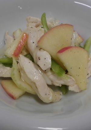 A picture of Marinated chicken breast with apple and aromatic vegetables.