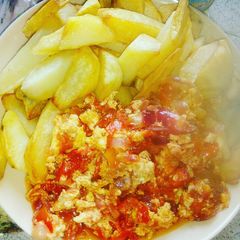 A picture of Fried Irish potatoes with egg sauce.