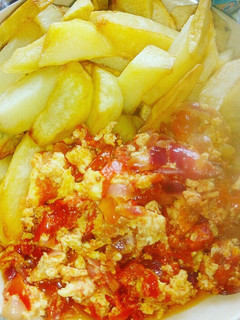 A picture of Fried Irish potatoes with egg sauce.