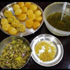 A picture of Pani Puri with Masala and Chutney.