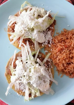 A picture of Beef Tinga Tostadas.