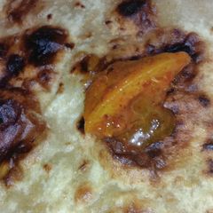 A picture of Parantha with Pickle.