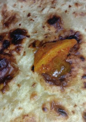 A picture of Parantha with Pickle.