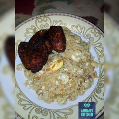 Jollof rice with scrambled eggs A picture of Jollof rice with scrambled eggs.