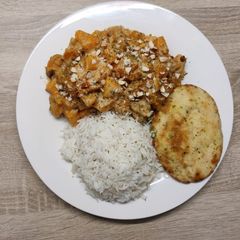A picture of Butternut korma with mini naans.