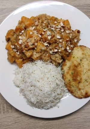 A picture of Butternut korma with mini naans.