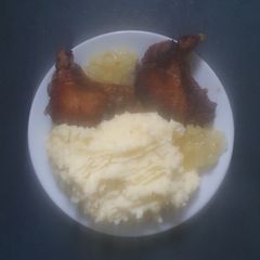A picture of Pan fried Pork Chops and Mash.