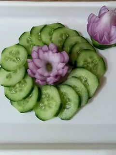 A picture of Salad, cucumber and onion🥒🧅🥒🧅.