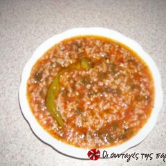 A picture of Tomato rice in the pot.