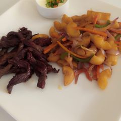 A picture of Fried macoroni with beef.strips.