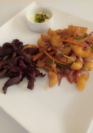 A picture of Fried macoroni with beef.strips.