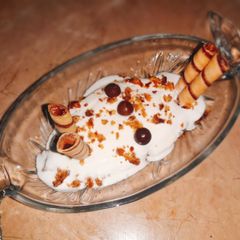 A picture of Chocolate and vanilla Cake and ice cream sandae.